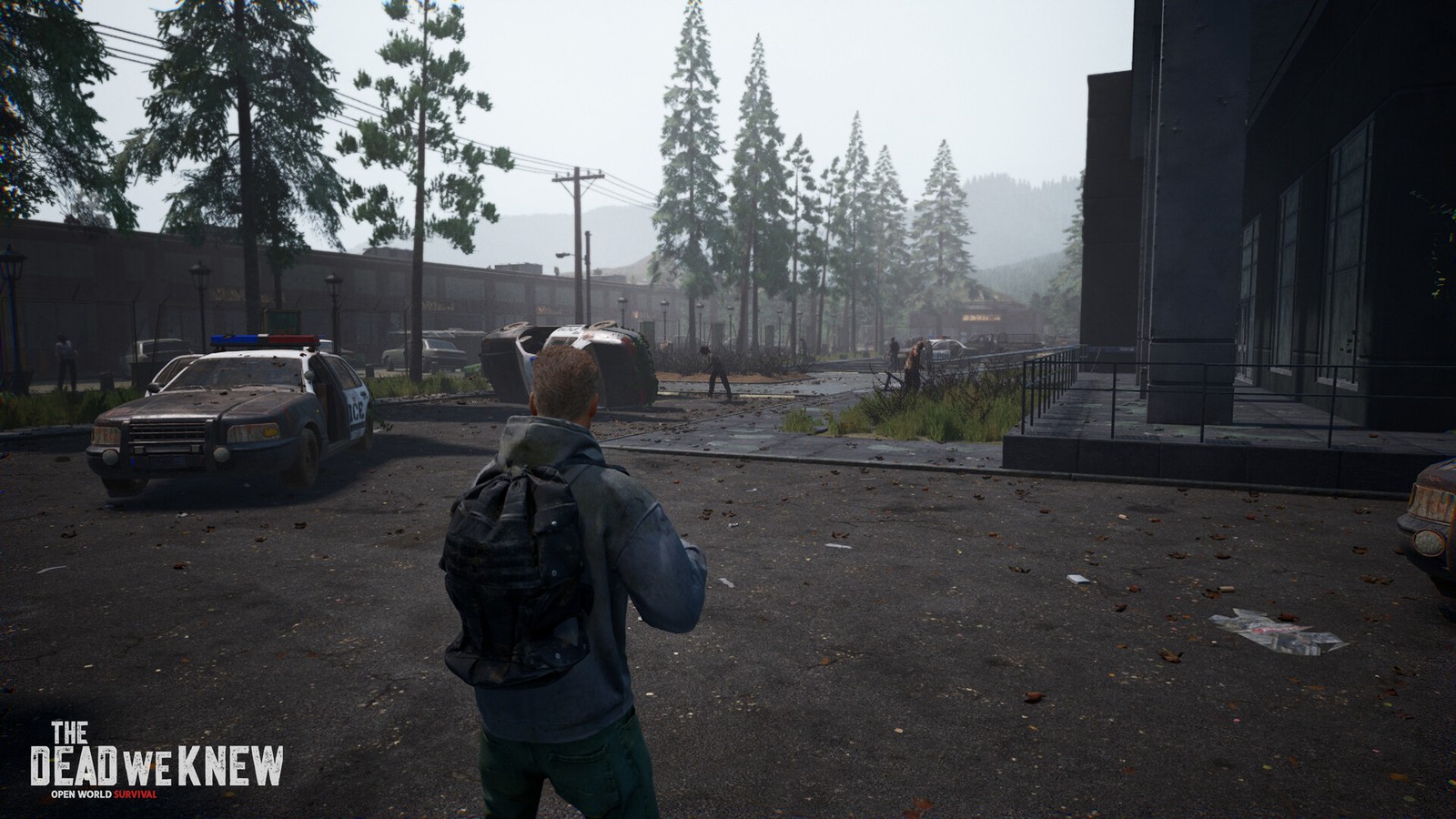 Town street with police cars zombies and foggy mountain backdrop